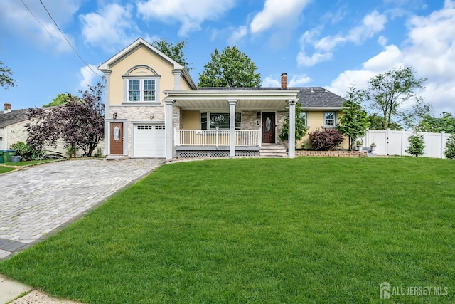 34 Sims Rd, Edison, NJ 08817 - view of front of home with covered porch, stucco siding, a garage, stone siding, and decorative driveway