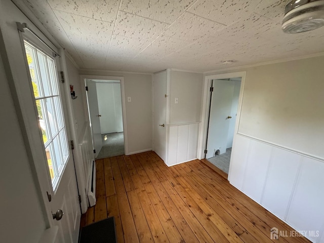 unfurnished room with light hardwood / wood-style floors