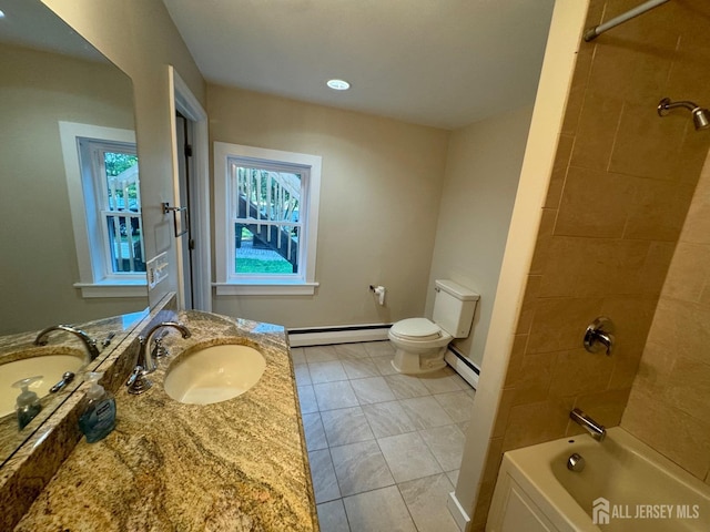 full bathroom with toilet, tiled shower / bath combo, vanity, and baseboard heating