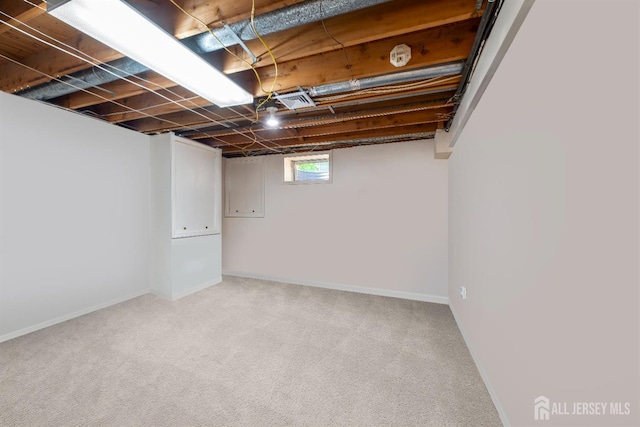 basement with carpet and baseboards