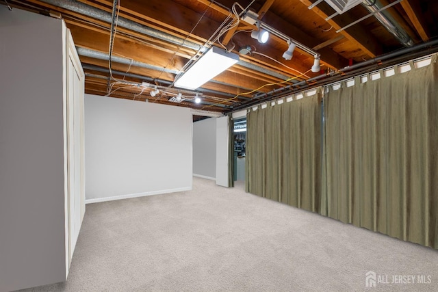 below grade area with carpet floors and baseboards