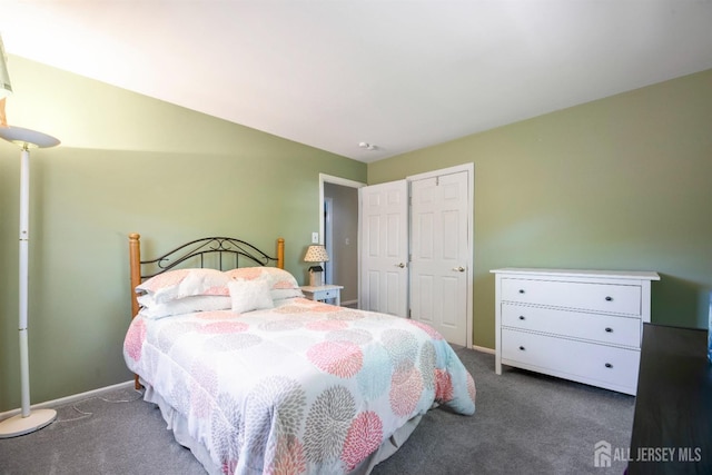 bedroom with carpet flooring and baseboards