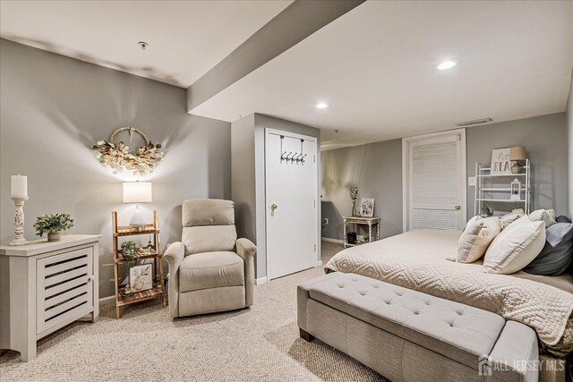 bedroom featuring light carpet, baseboards, and recessed lighting