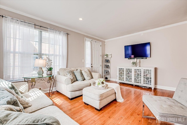 living area with ornamental molding, baseboards, wood finished floors, and recessed lighting