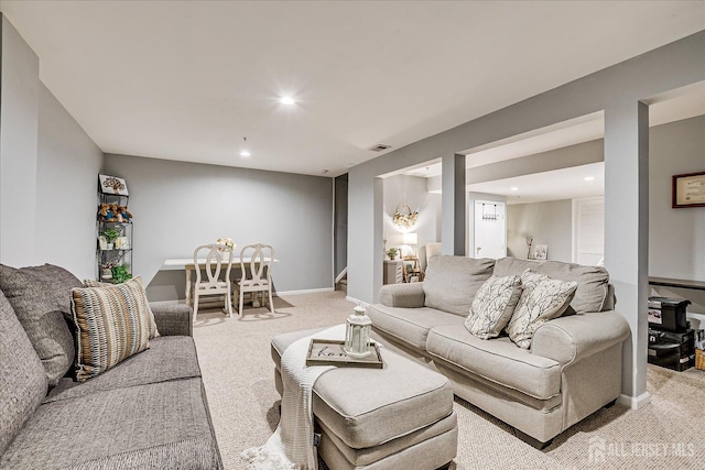 living area featuring light colored carpet, recessed lighting, and baseboards