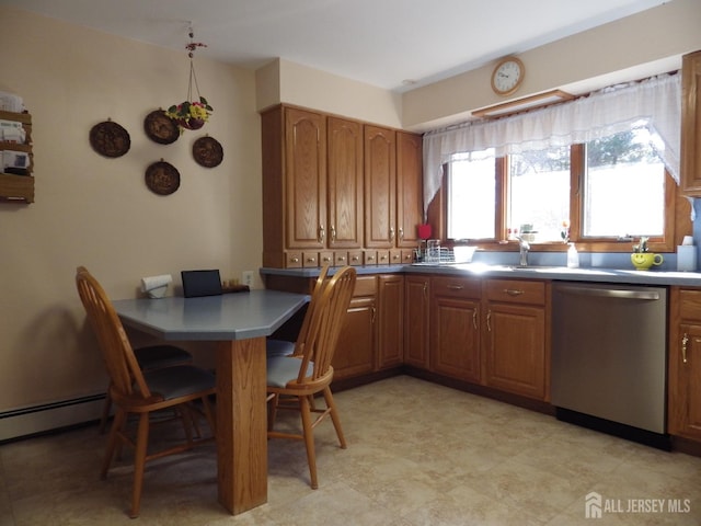 kitchen featuring dishwasher, a peninsula, a breakfast bar, and brown cabinetry