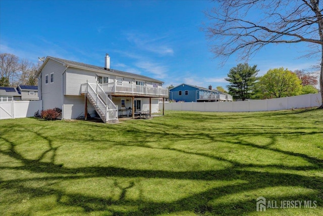 16 Dutch Valley Rd, Howell, NJ 07731 - rear view of property with stairs, a deck, and a chimney