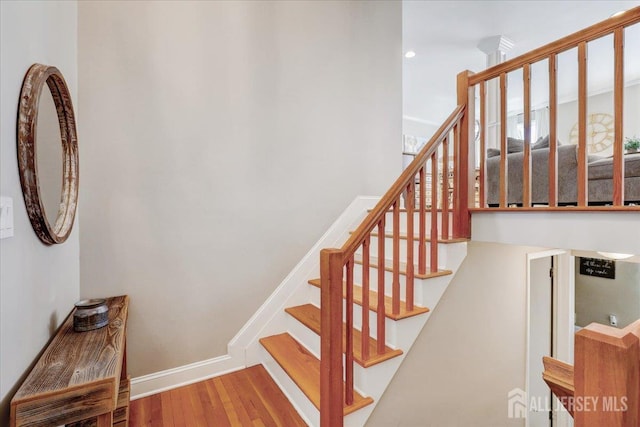 16 Dutch Valley Rd, Howell, NJ 07731 - staircase with wood finished floors and baseboards