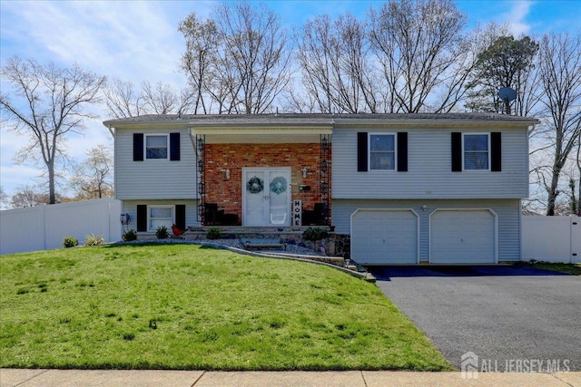 16 Dutch Valley Rd, Howell, NJ 07731 - raised ranch featuring a garage and asphalt driveway
