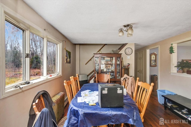54 E Greystone Rd, Old Bridge, NJ 08857 - dining area with a textured ceiling and wood finished floors