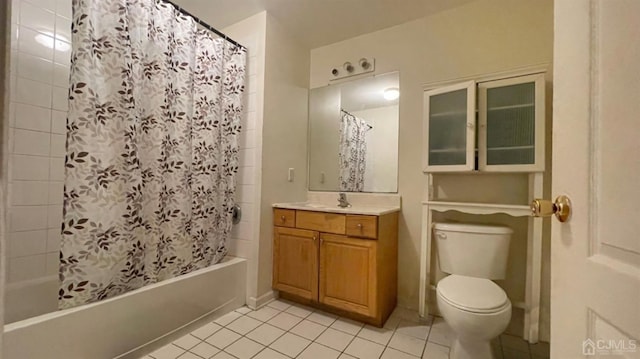 full bathroom with vanity, tile patterned flooring, toilet, and shower / bath combo with shower curtain