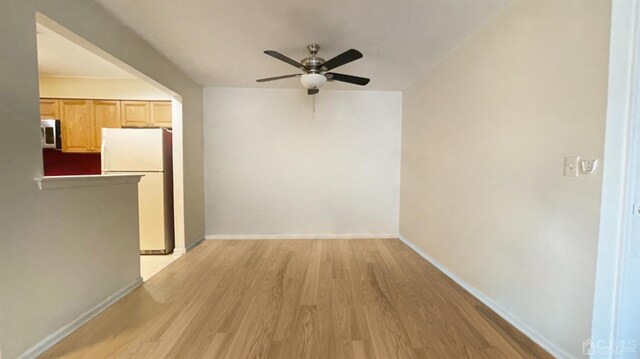 hall with light hardwood / wood-style flooring