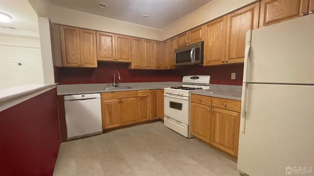 kitchen with sink and white appliances