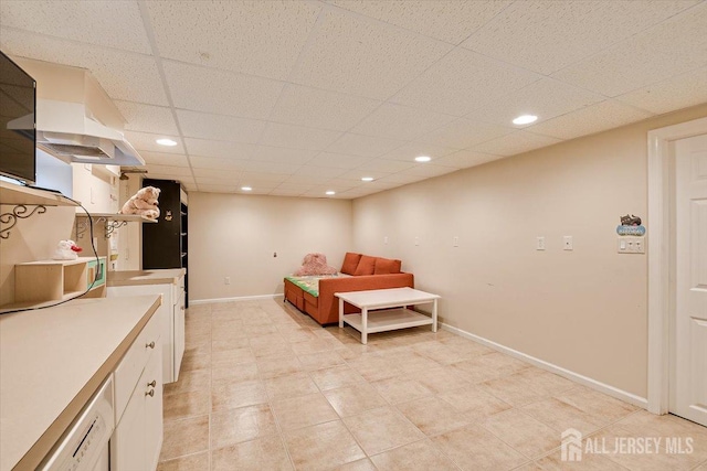 interior space with a paneled ceiling