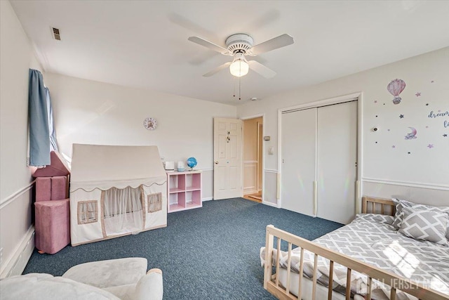 bedroom with carpet floors, a closet, and ceiling fan