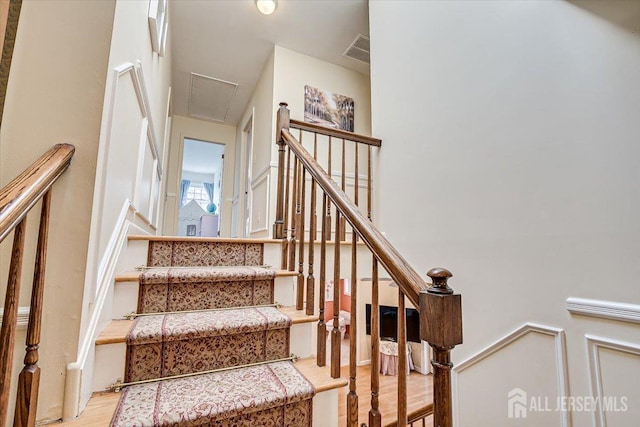 stairway featuring hardwood / wood-style flooring