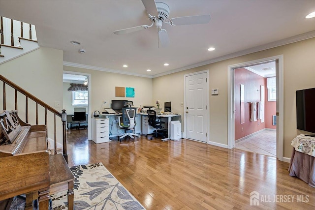 office area featuring crown molding, ceiling fan, and light hardwood / wood-style floors