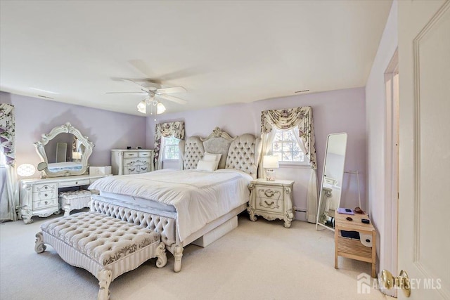 carpeted bedroom featuring ceiling fan