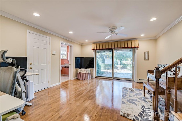 living room featuring ceiling fan, ornamental molding, plenty of natural light, and light wood-type flooring