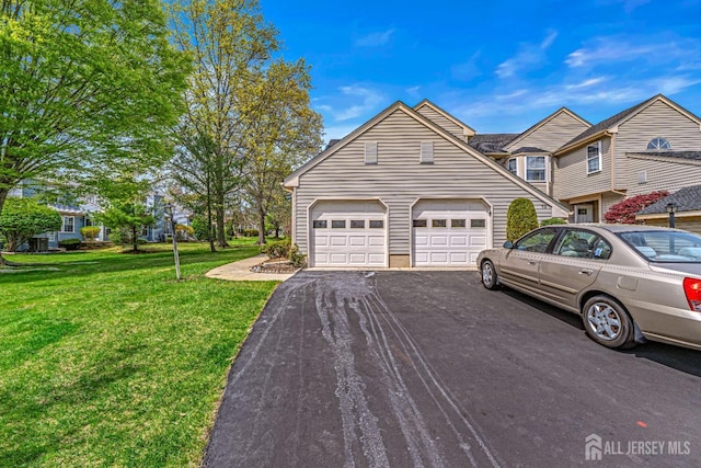 3 Bristol Ct Unit D, Monroe, NJ 08831 - view of front facade featuring asphalt driveway, a front lawn, and a garage