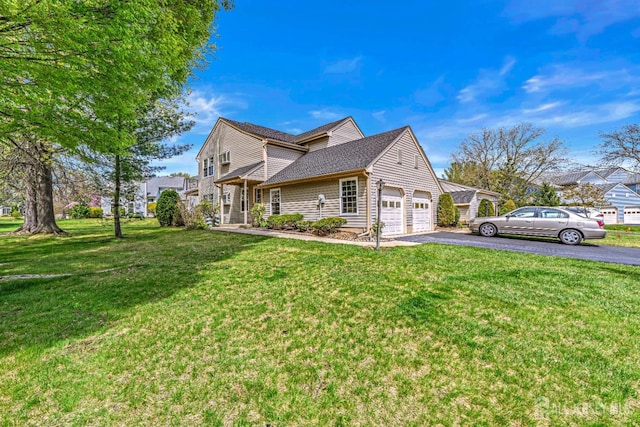3 Bristol Ct Unit D, Monroe, NJ 08831 - view of side of property featuring driveway, a lawn, an attached garage, and roof with shingles