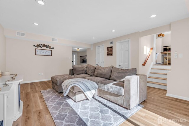 living room with light hardwood / wood-style flooring