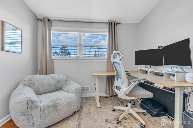 office space featuring light hardwood / wood-style floors