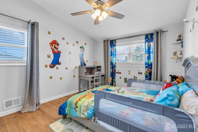 bedroom featuring wood-type flooring and ceiling fan