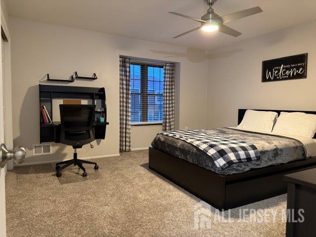 13 Heritage Ln, Fords, NJ 08863 - carpeted bedroom featuring baseboards and a ceiling fan
