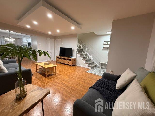 13 Heritage Ln, Fords, NJ 08863 - living room with stairs, light wood-style flooring, recessed lighting, and baseboards