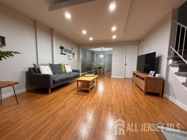 13 Heritage Ln, Fords, NJ 08863 - living area featuring stairway, light wood-type flooring, baseboards, and recessed lighting