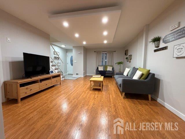 13 Heritage Ln, Fords, NJ 08863 - living room with stairs, light wood finished floors, baseboards, and recessed lighting