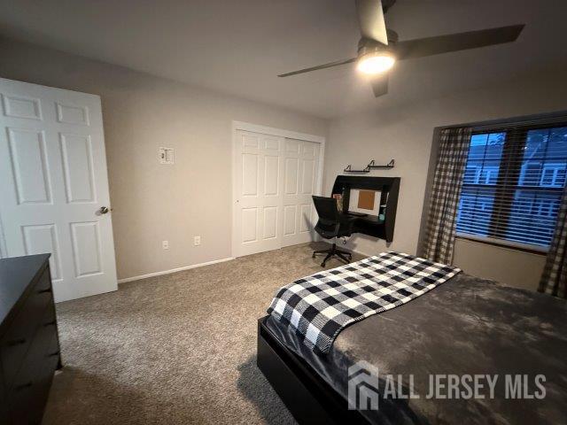13 Heritage Ln, Fords, NJ 08863 - carpeted bedroom featuring a closet, baseboards, and a ceiling fan