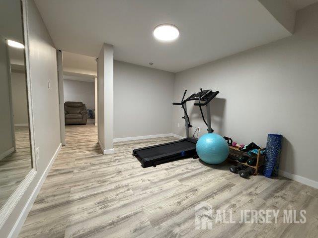 13 Heritage Ln, Fords, NJ 08863 - workout room with wood finished floors and baseboards