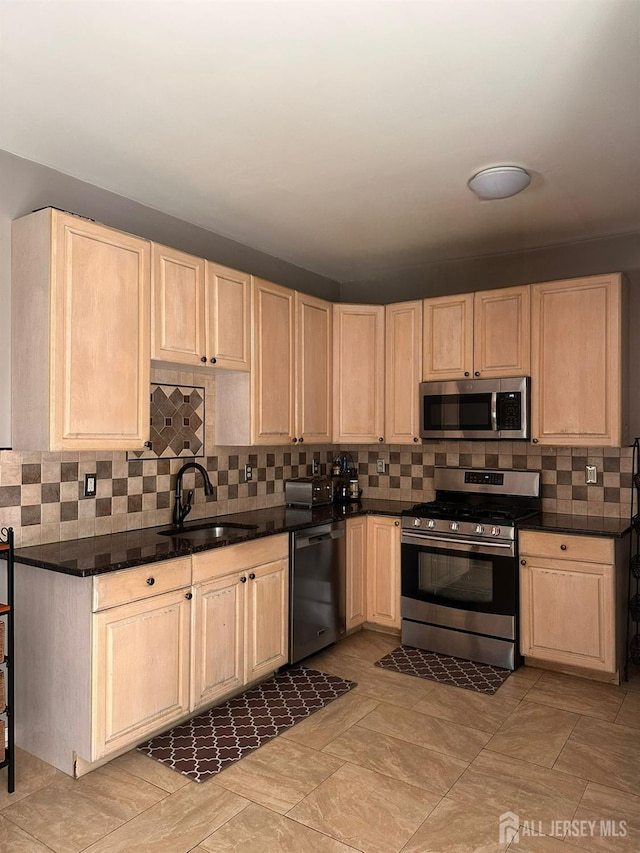 76 Tennyson Rd, East Windsor, NJ 08520 - kitchen with appliances with stainless steel finishes, light brown cabinetry, and backsplash
