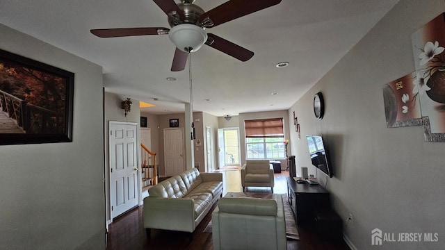 76 Tennyson Rd, East Windsor, NJ 08520 - living room featuring dark wood finished floors, ceiling fan, and stairs