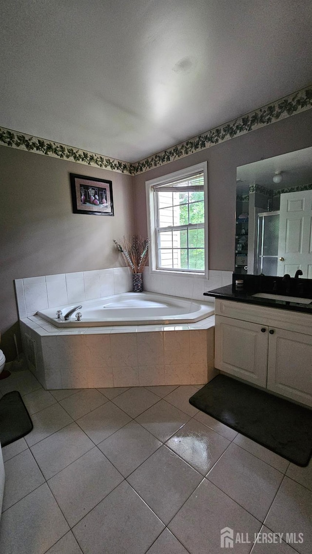 76 Tennyson Rd, East Windsor, NJ 08520 - full bathroom featuring a bath, vanity, tile patterned floors, and a stall shower