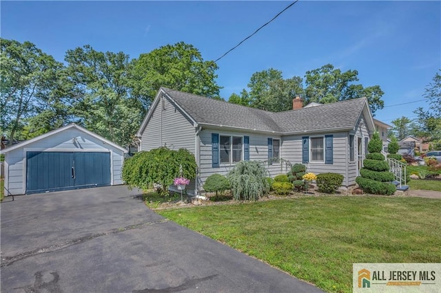 706 Wood Ave, North Brunswick, NJ 08902 - view of front of property featuring an outbuilding, a chimney, a detached garage, a front lawn, and a shingled roof