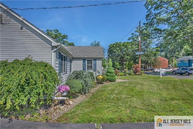 706 Wood Ave, North Brunswick, NJ 08902 - view of home's exterior featuring a lawn