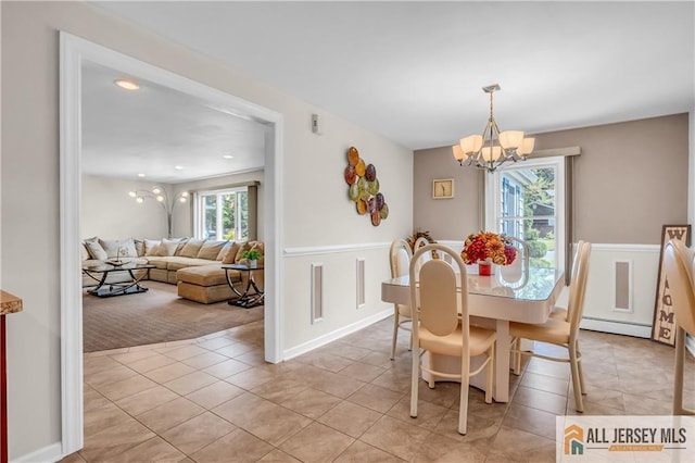706 Wood Ave, North Brunswick, NJ 08902 - dining area featuring a chandelier, baseboard heating, light tile patterned floors, a wainscoted wall, and recessed lighting