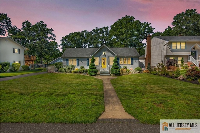 706 Wood Ave, North Brunswick, NJ 08902 - view of front of house featuring a front lawn