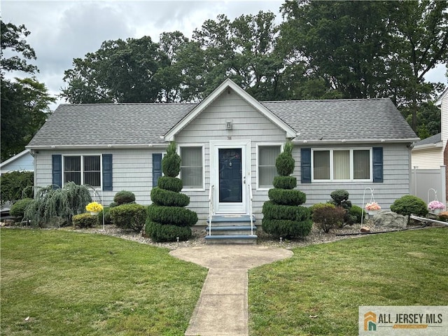 706 Wood Ave, North Brunswick, NJ 08902 - view of front of property with roof with shingles and a front yard