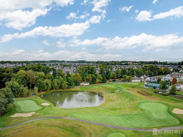 view of home's community featuring a water view, a putting green, golf course view, and view of wooded area