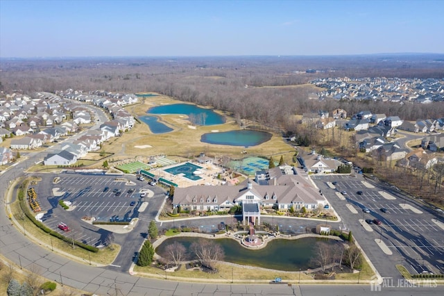 view of property location with a large body of water and nearby suburban area