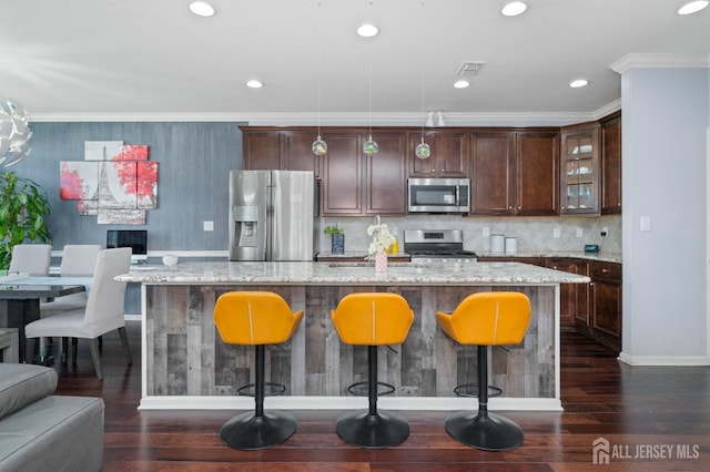 31 Morris Ln, Cranbury, NJ 08512 - kitchen featuring appliances with stainless steel finishes, a kitchen breakfast bar, a large island with sink, dark wood-style flooring, and dark brown cabinetry