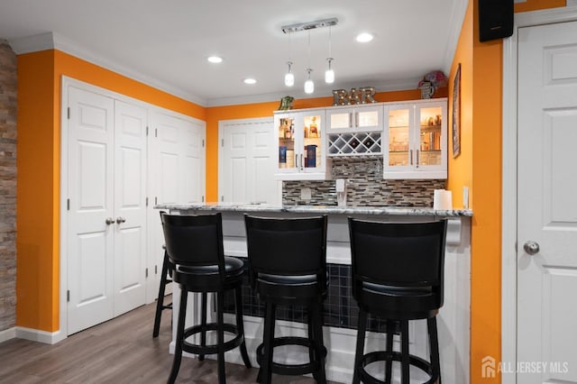31 Morris Ln, Cranbury, NJ 08512 - indoor wet bar featuring crown molding, wood finished floors, decorative backsplash, decorative light fixtures, and recessed lighting