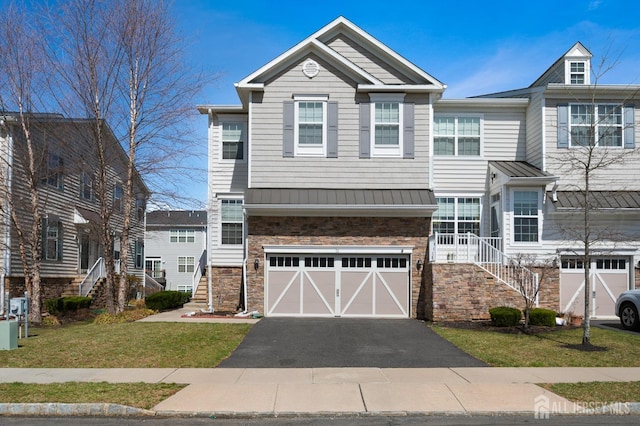 31 Morris Ln, Cranbury, NJ 08512 - townhome / multi-family property featuring stairway, a standing seam roof, stone siding, an attached garage, and metal roof