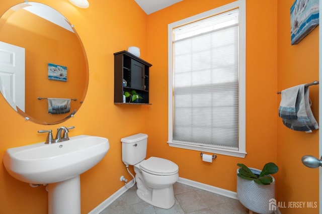31 Morris Ln, Cranbury, NJ 08512 - bathroom featuring baseboards, toilet, tile patterned flooring, and a sink