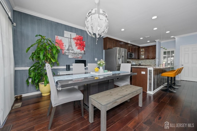 31 Morris Ln, Cranbury, NJ 08512 - dining room with recessed lighting, dark wood finished floors, a chandelier, ornamental molding, and baseboards