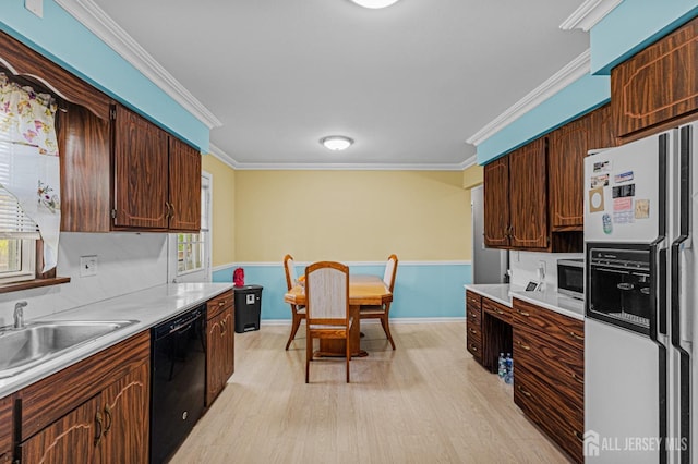 kitchen with white fridge with ice dispenser, black dishwasher, light wood-style floors, crown molding, and light countertops